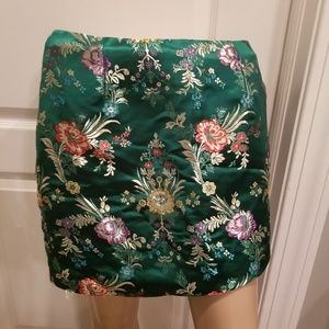 Embroidered green satin skirt